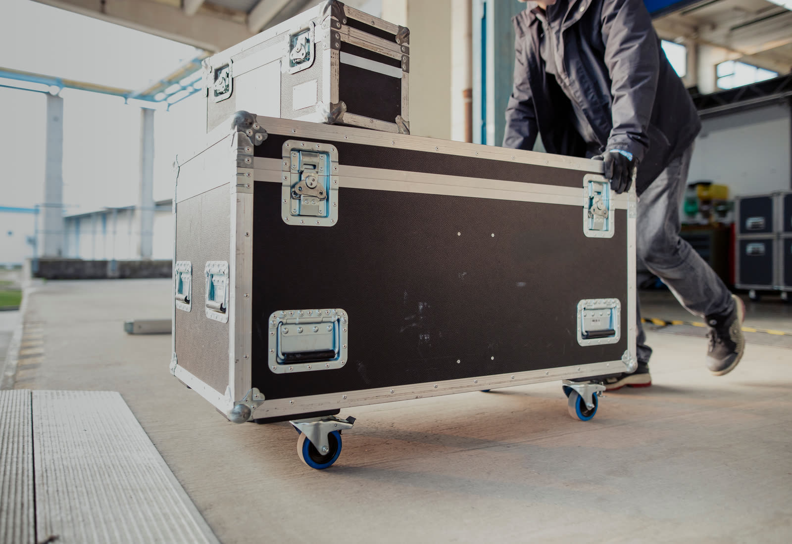 Secure transit cases being moved for a bulk deployment