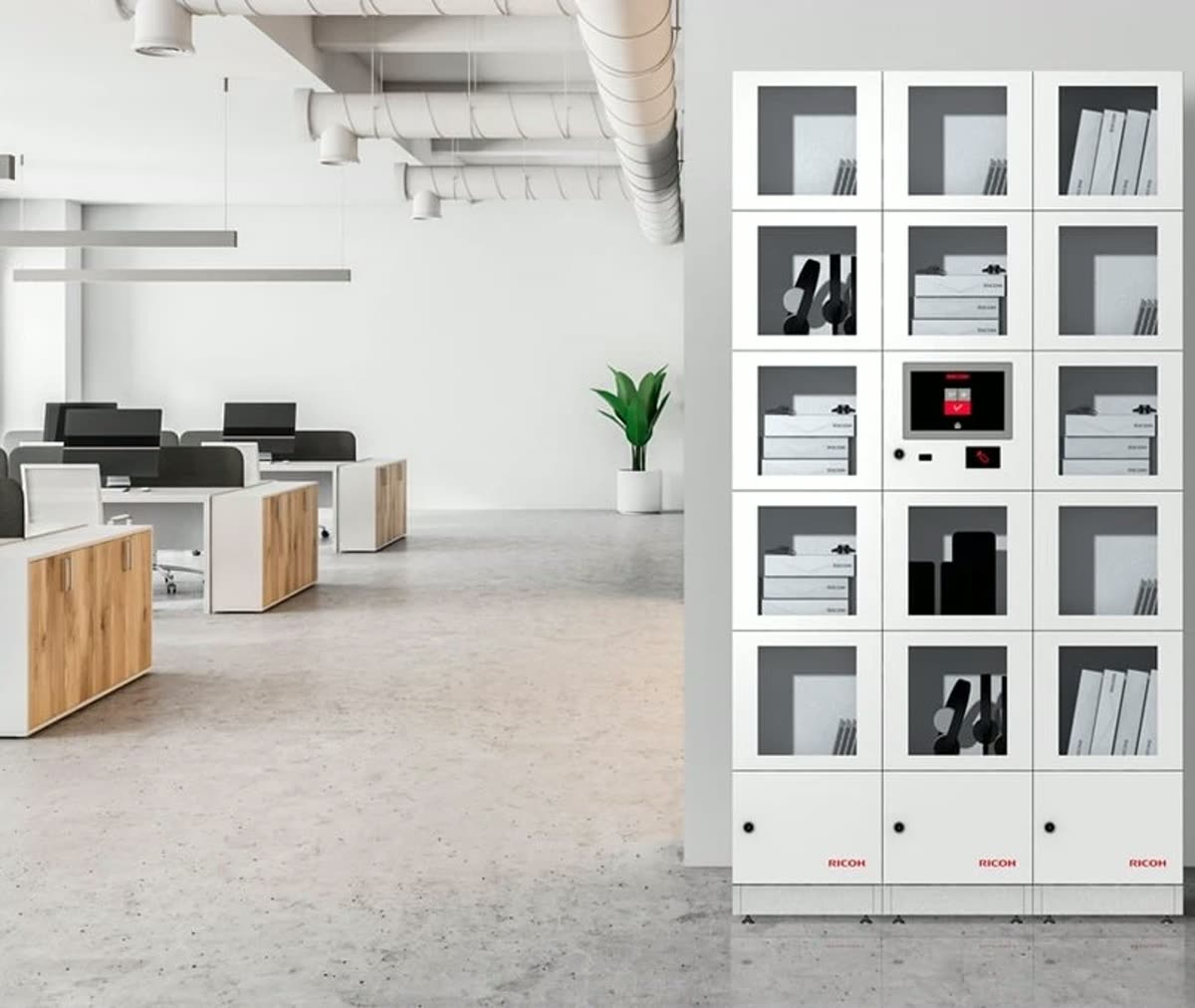 A bank of private smart lockers installed in an office, stocked with laptops and headsets