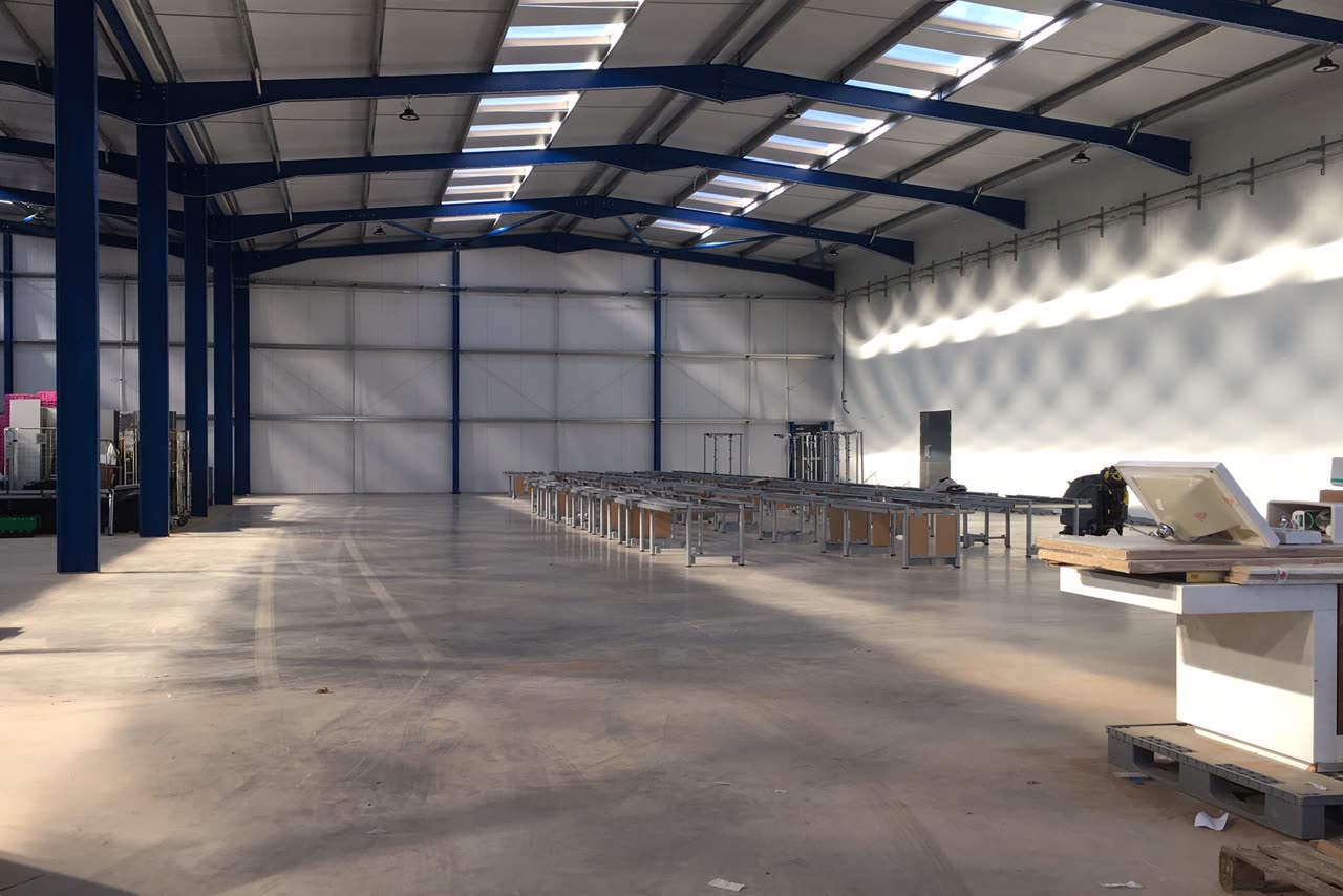 Workbenches being installed in a newly prepared Greensafe facility