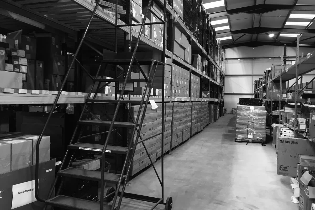 A racking aisle stacked to full height with boxed and labelled stock