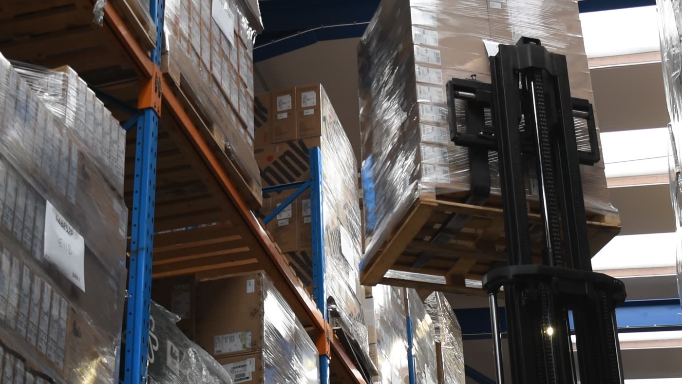 Boxed stock racked and labelled by location