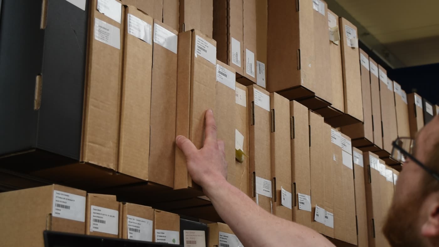 Labelled stock boxes on warehouse shelving