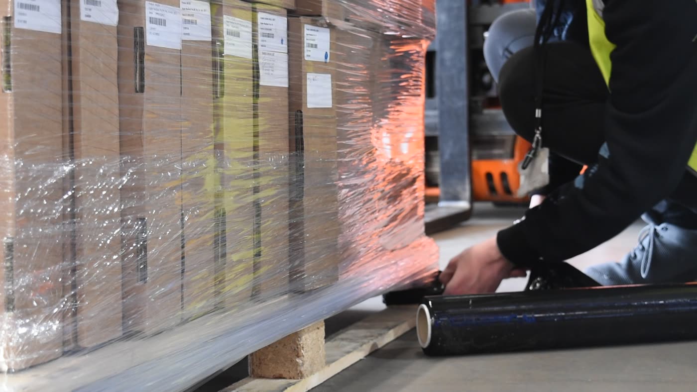 A picked pallet being wrapped for release from the warehouse
