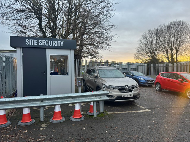 The Berry Hill site security hut beside the visitor parking spaces
